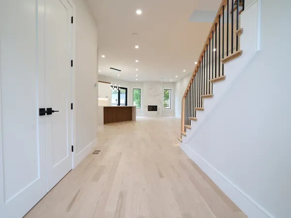 a view of entryway with wooden floor