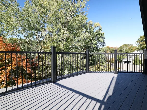 a view of a balcony with wooden floor