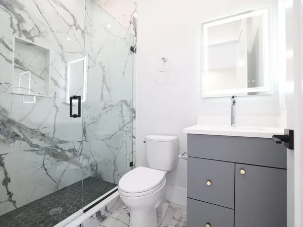 a bathroom with a bathtub and shower