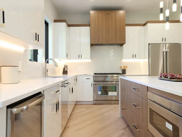 a kitchen with a sink stove and cabinets