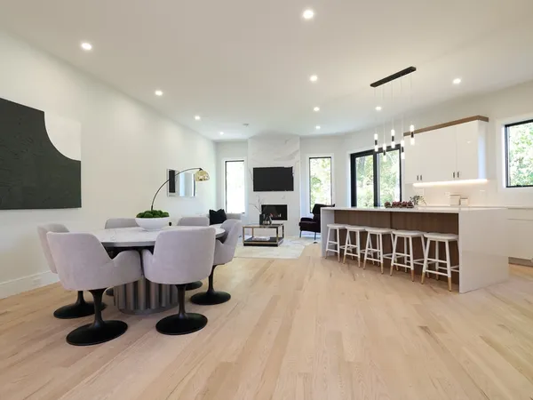 a view of a dining room with furniture window and wooden floor