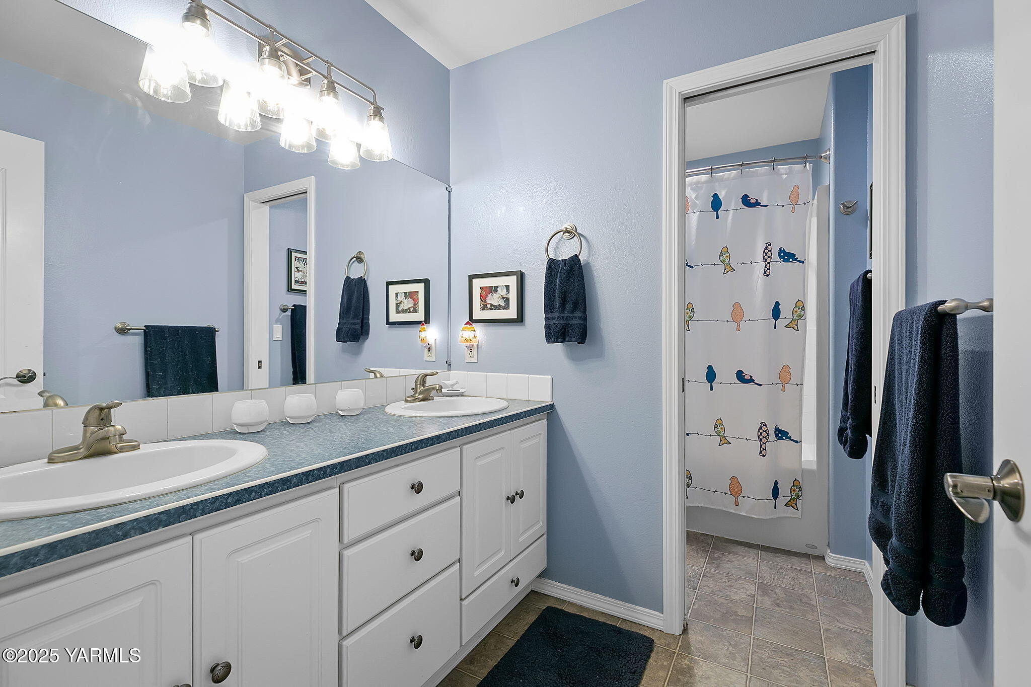 1701 Mapleway Road Yakima, WA 98908 - Photo 19 of 35 a spacious bathroom with a granite countertop sink a mirror a vanity and a shower