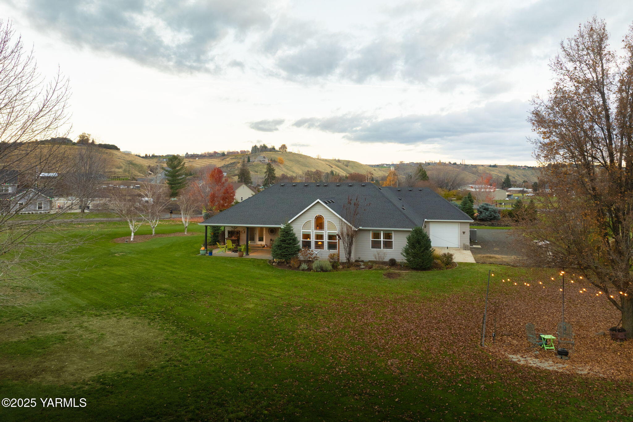 1701 Mapleway Road Yakima, WA 98908 - Photo 31 of 35 a view of a big house with a big yard and large trees