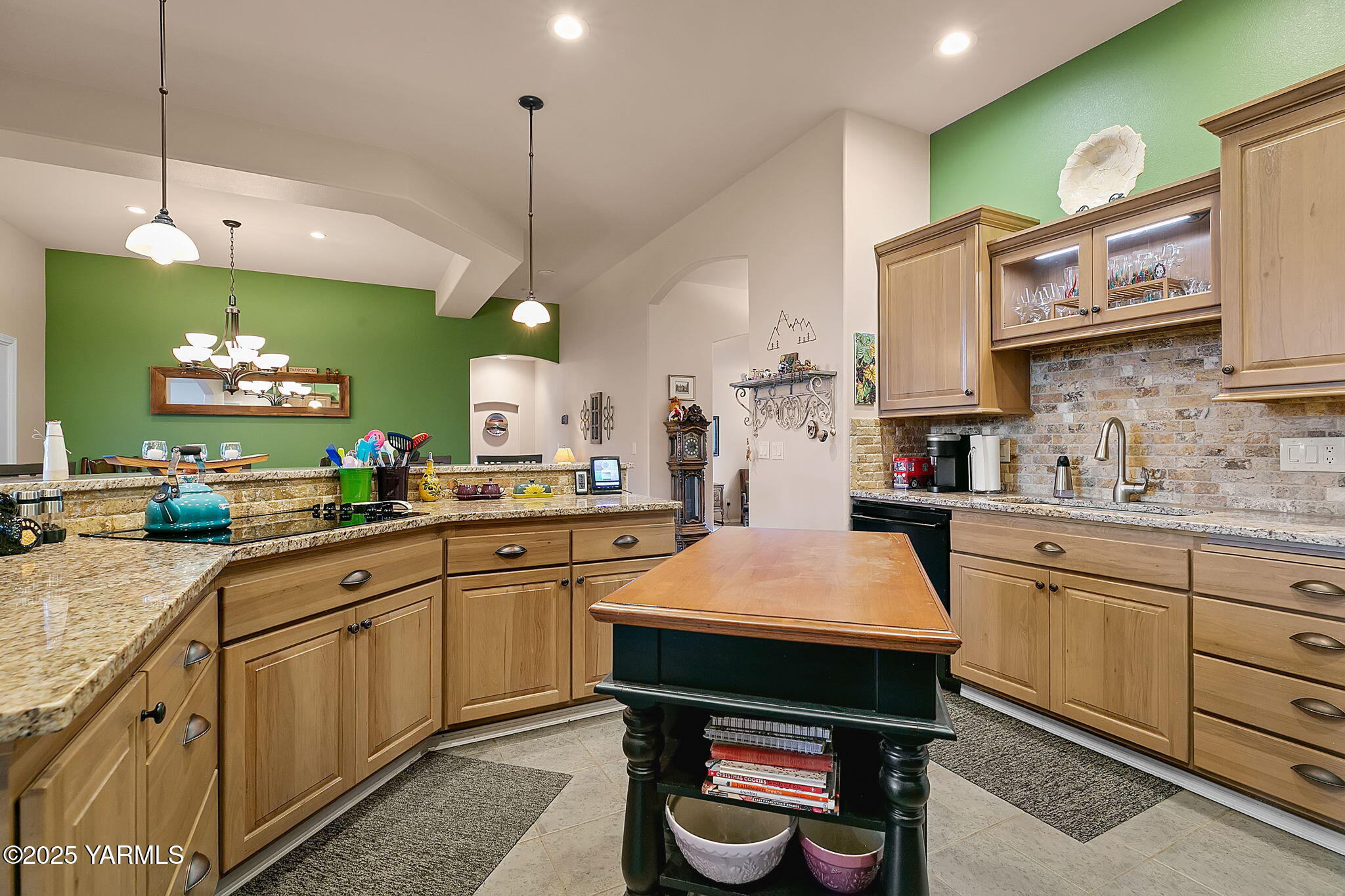 1701 Mapleway Road Yakima, WA 98908 - Photo 9 of 35 a kitchen with kitchen island granite countertop appliances cabinets and a sink