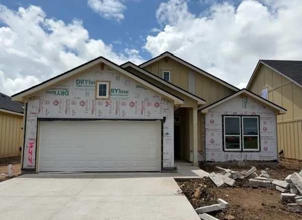 a front view of a house with a garage