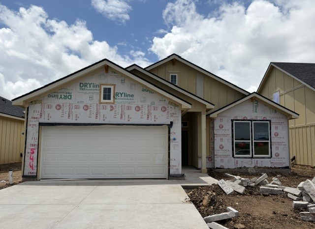 544 Gus Loop Georgetown, TX 78626 - Photo 1 of 22 a front view of a house with a garage