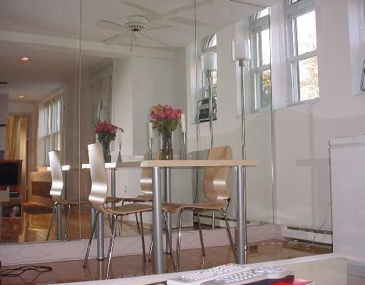 22 Glenbrook Road, Unit 216 Stamford, CT 06902 - Photo 1 of 1 a view of a dining room with furniture and a chandelier fan