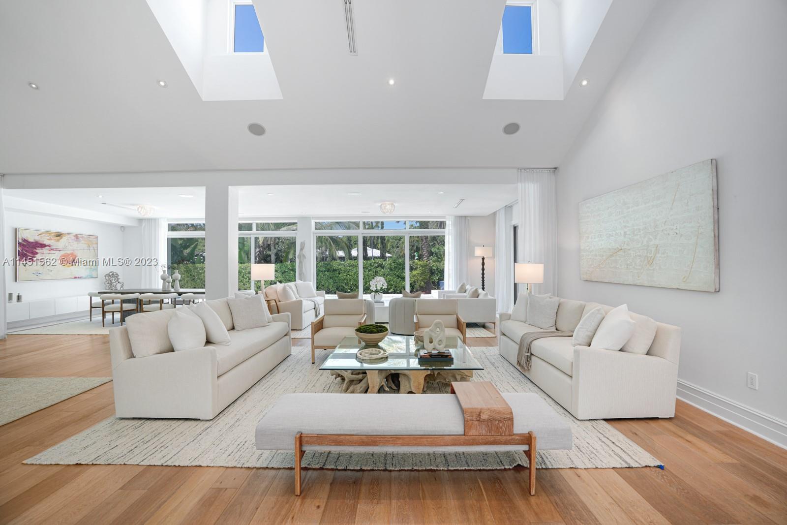 761 Buttonwood Lane Miami, FL 33137 - Photo 11 of 64 a living room with furniture large window and a wooden floor