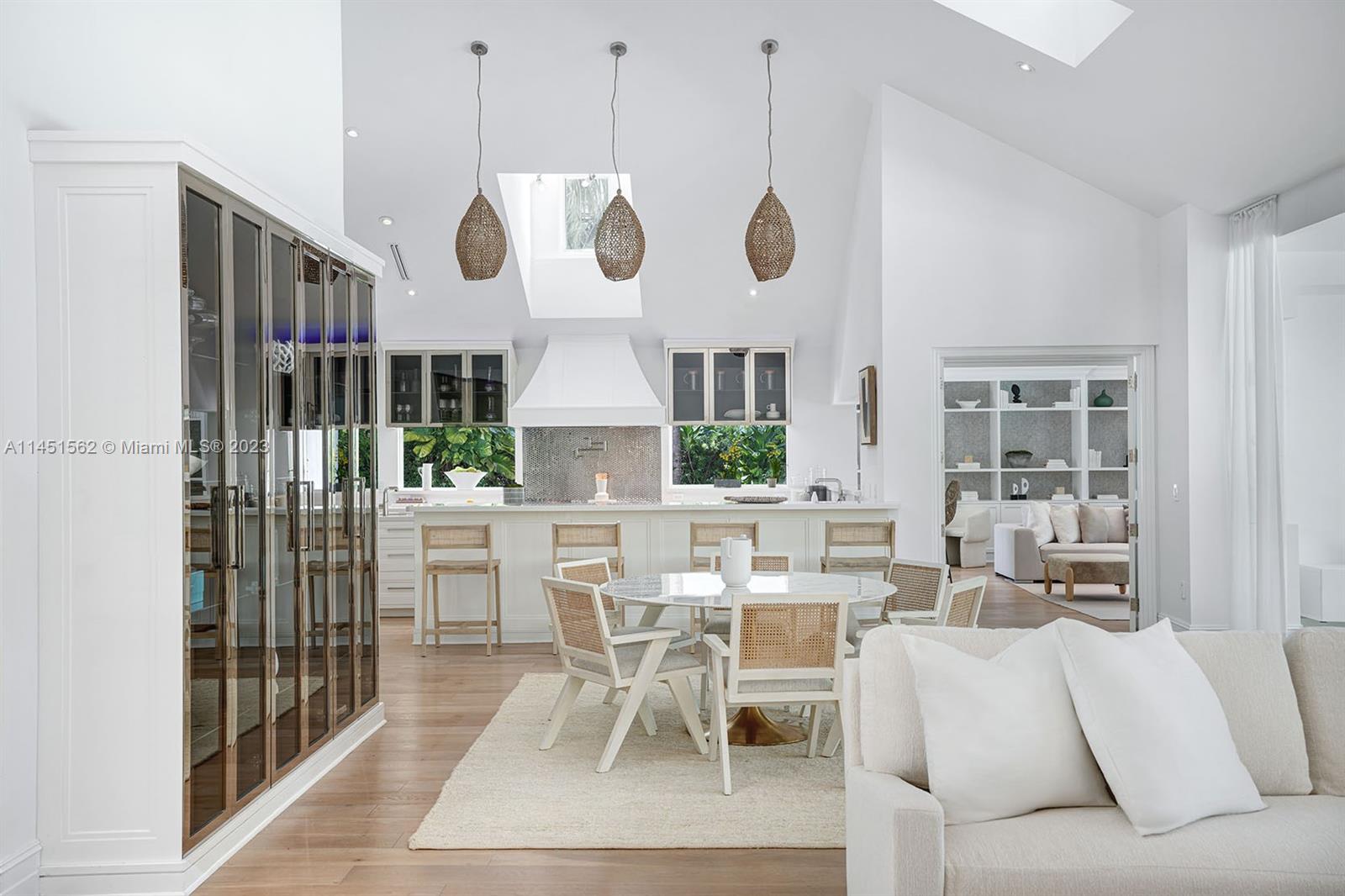 761 Buttonwood Lane Miami, FL 33137 - Photo 14 of 64 a view of a dining room with furniture window and wooden floor