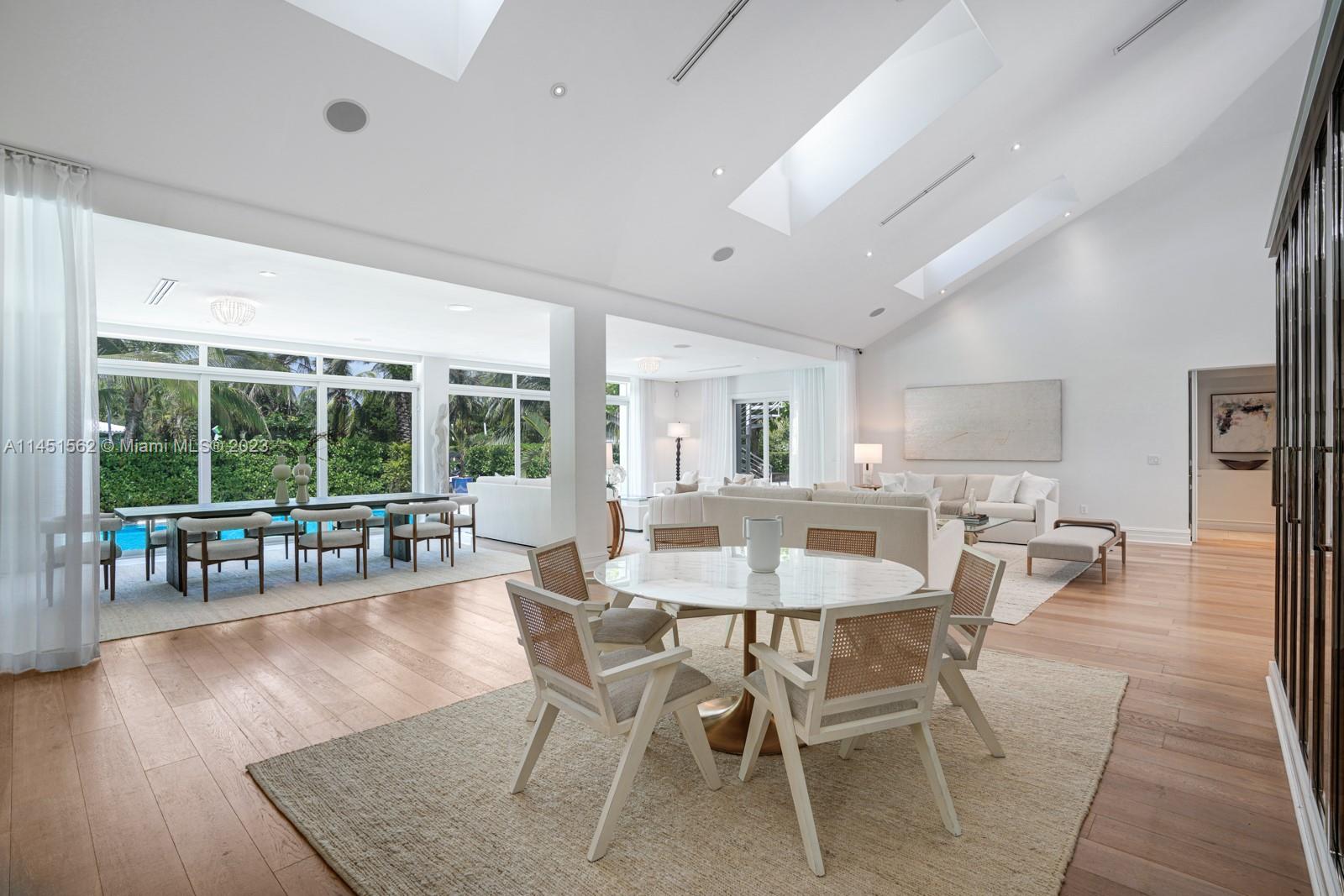 761 Buttonwood Lane Miami, FL 33137 - Photo 15 of 64 a dining room with furniture and wooden floor
