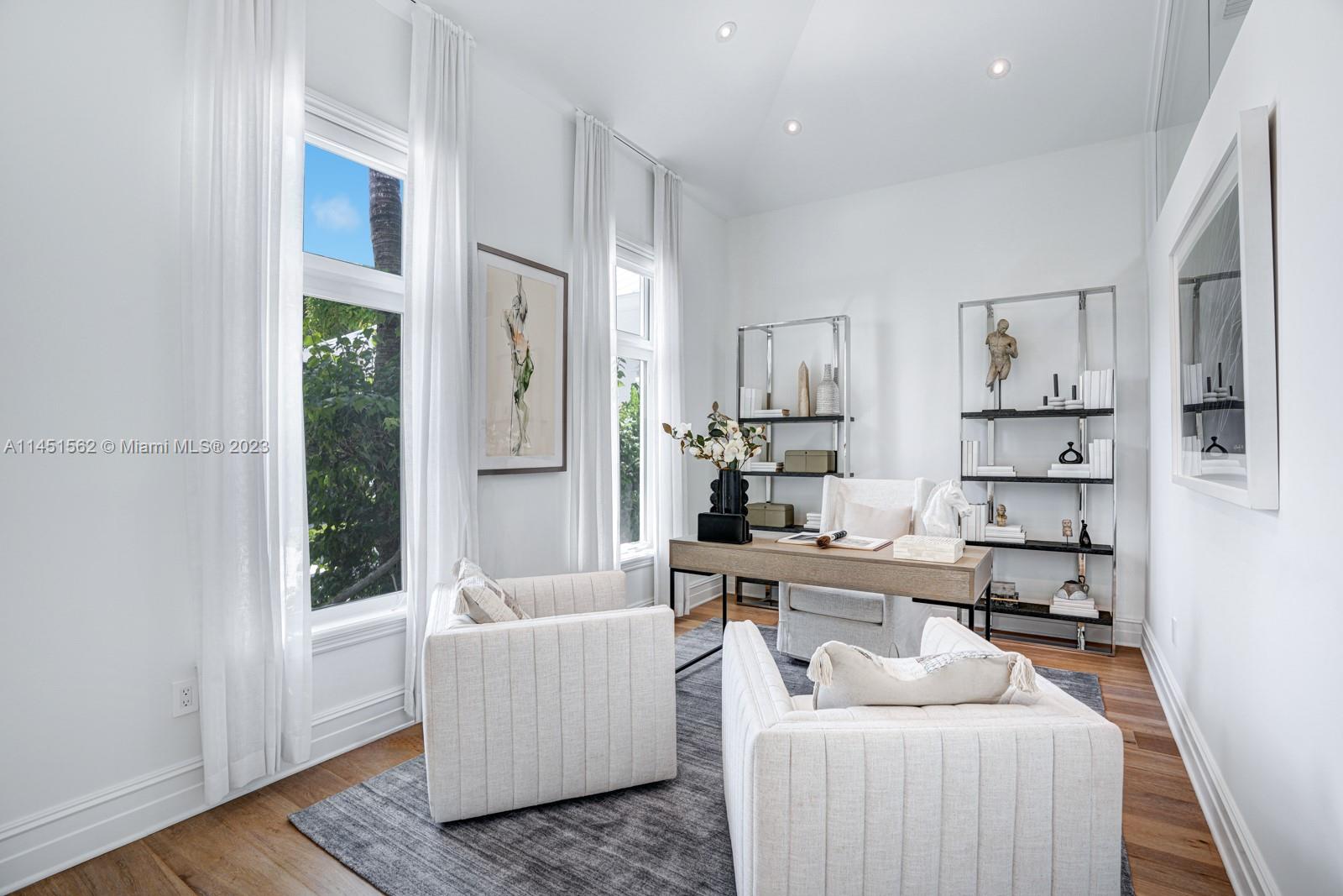 761 Buttonwood Lane Miami, FL 33137 - Photo 24 of 64 a living room with furniture and a window