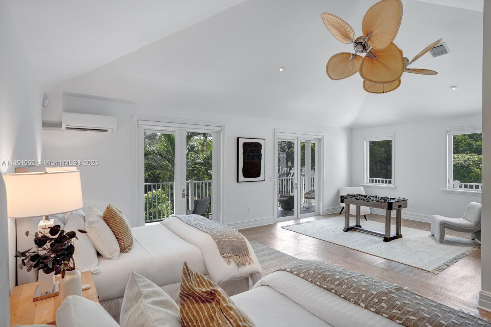 761 Buttonwood Lane Miami, FL 33137 - Photo 34 of 64 a living room with furniture ceiling fan and a window