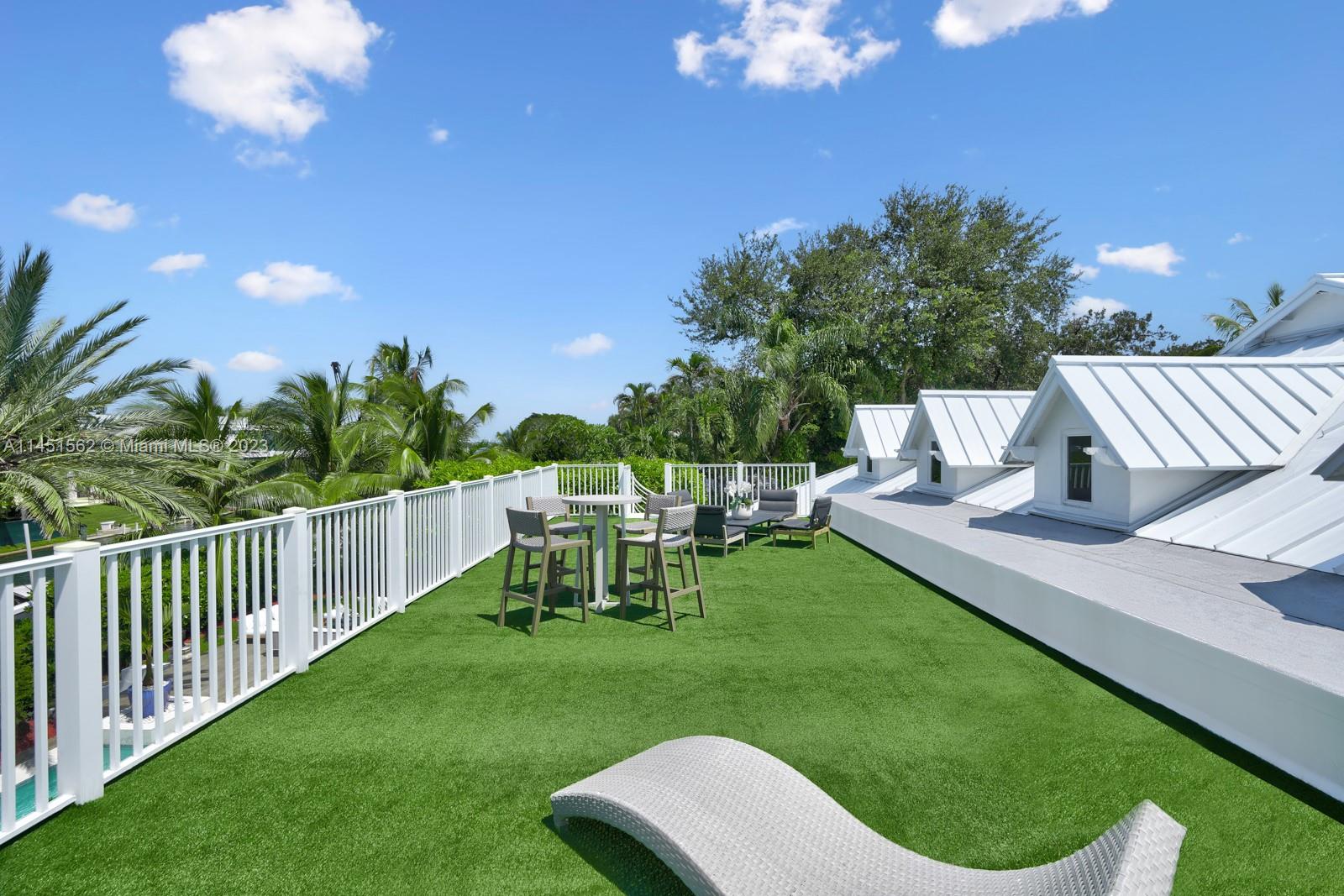 761 Buttonwood Lane Miami, FL 33137 - Photo 38 of 64 a view of a chair and table of the garden