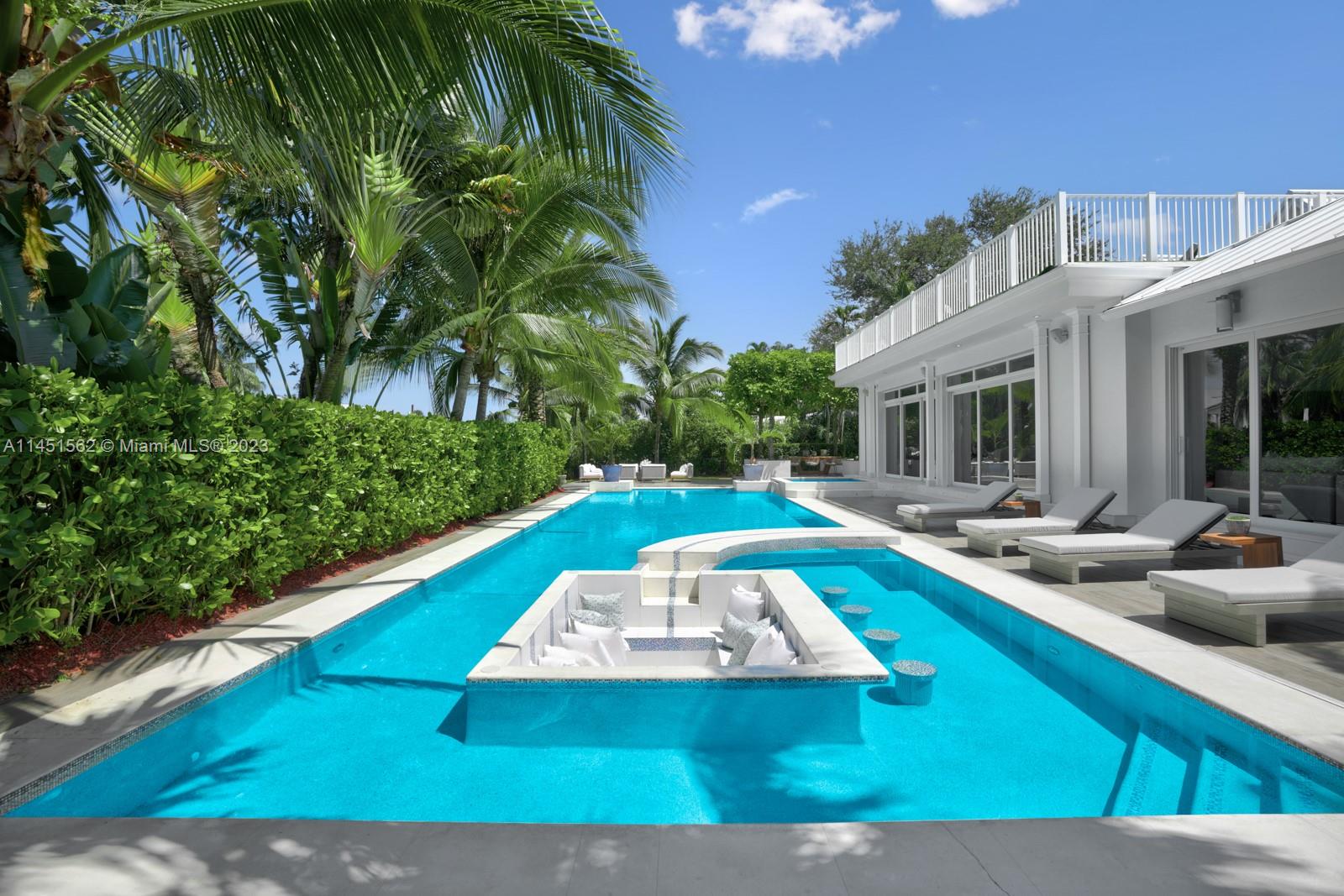 761 Buttonwood Lane Miami, FL 33137 - Photo 41 of 64 a view of a swimming pool with lounge chair