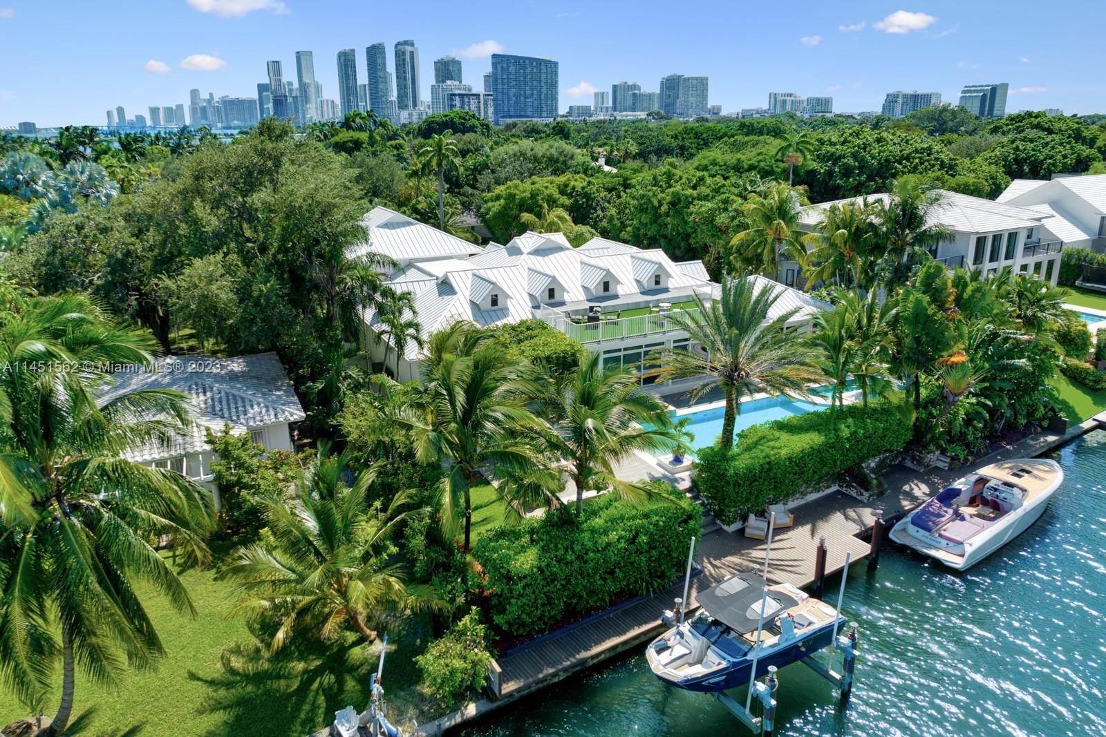 761 Buttonwood Lane Miami, FL 33137 - Photo 51 of 64 a view of a lake with a building in the background