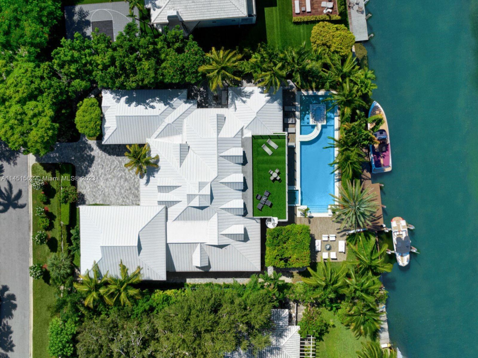 761 Buttonwood Lane Miami, FL 33137 - Photo 52 of 64 an aerial view of a house with garden space and street view