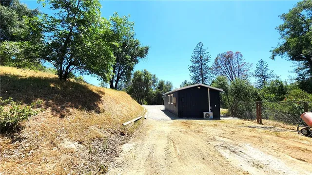 a view of wooden fence and trees