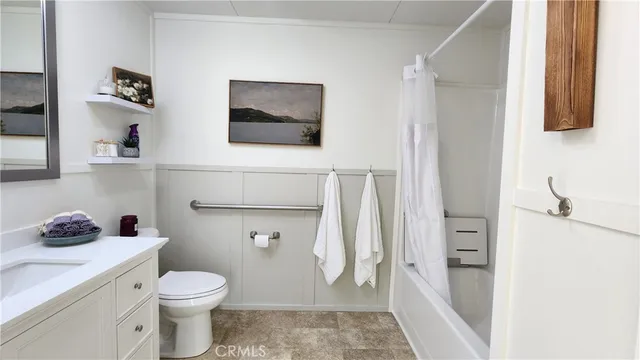 a bathroom with a toilet sink and shower