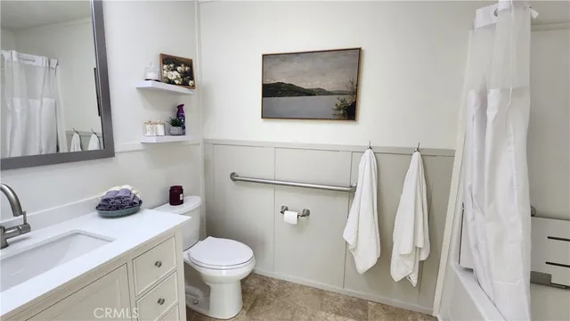 a bathroom with a sink toilet and vanity
