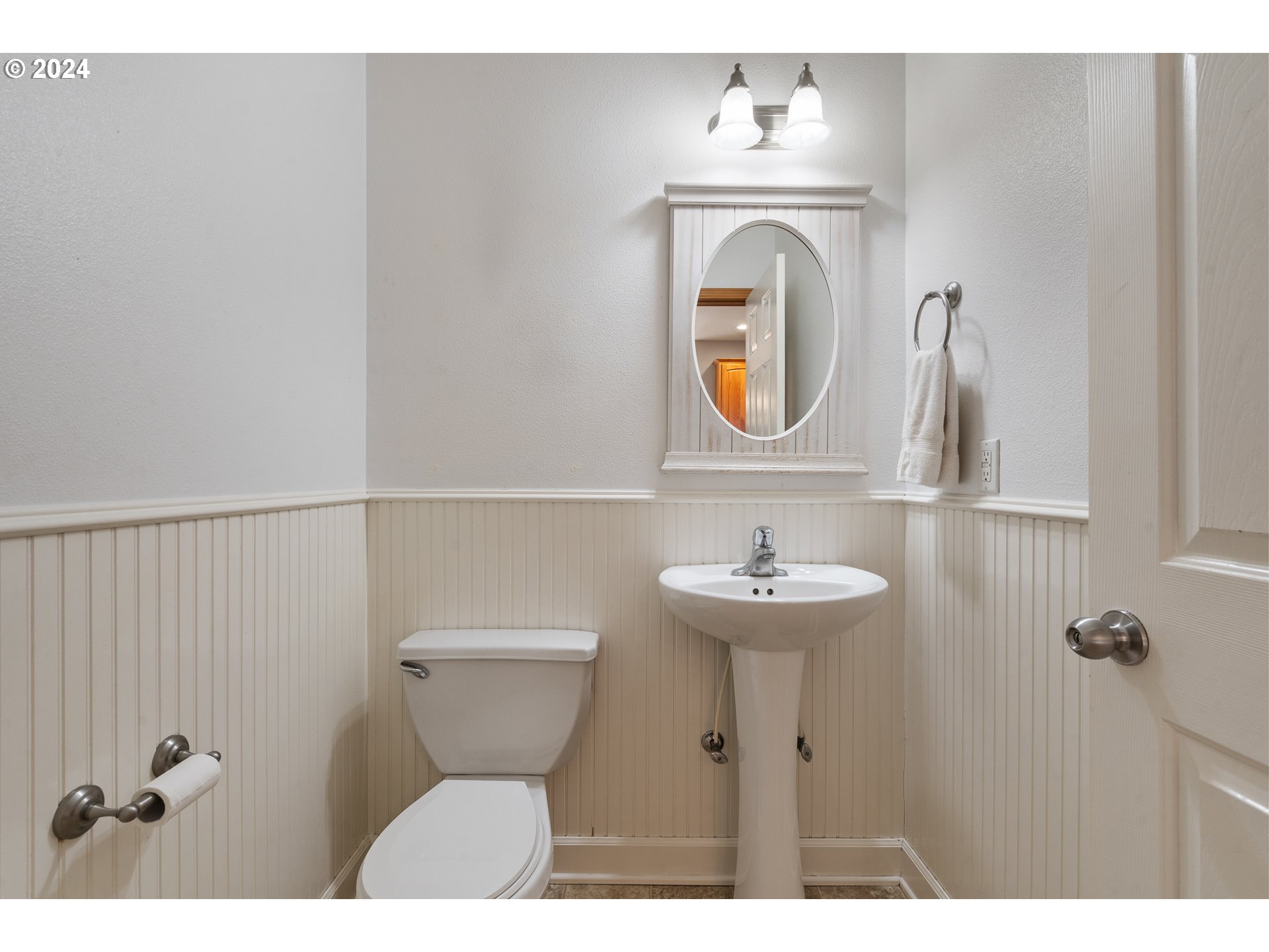 8009 Northeast 16th Street Vancouver, WA 98664 - Photo 14 of 46 a bathroom with a sink mirror and toilet