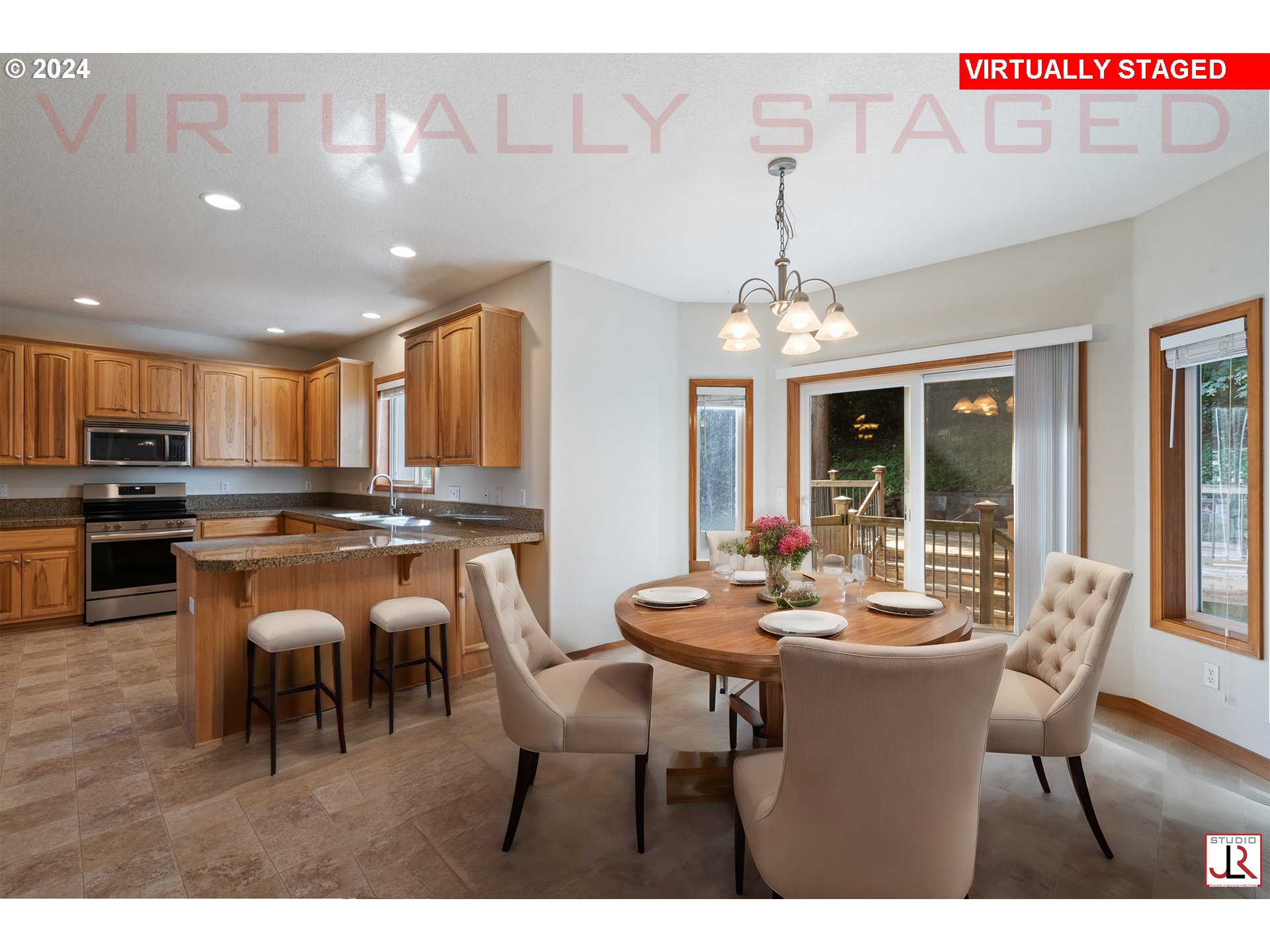 8009 Northeast 16th Street Vancouver, WA 98664 - Photo 15 of 46 a kitchen with a dining table chairs and stove