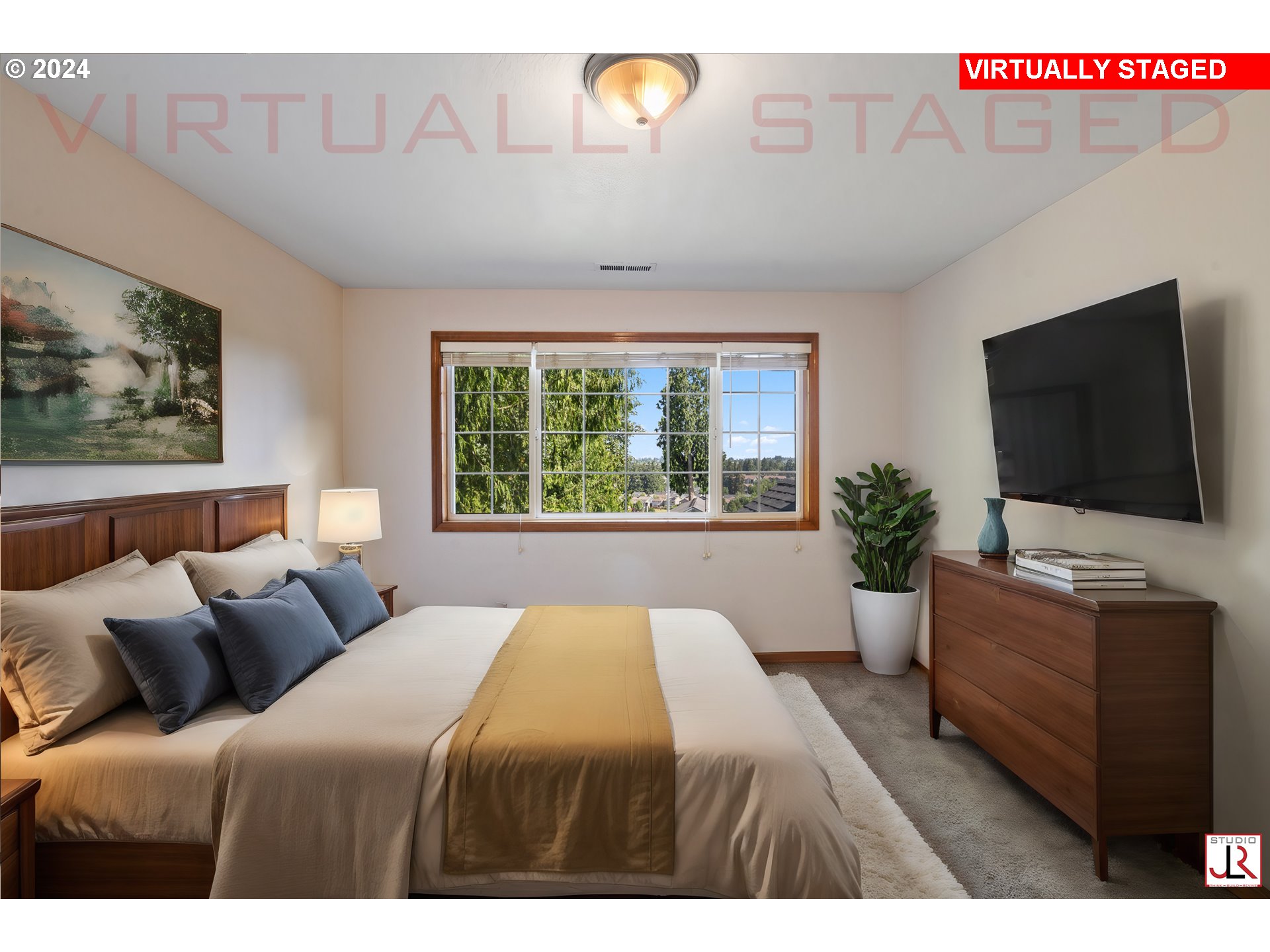 8009 Northeast 16th Street Vancouver, WA 98664 - Photo 34 of 46 a bedroom with a bed and a flat screen tv