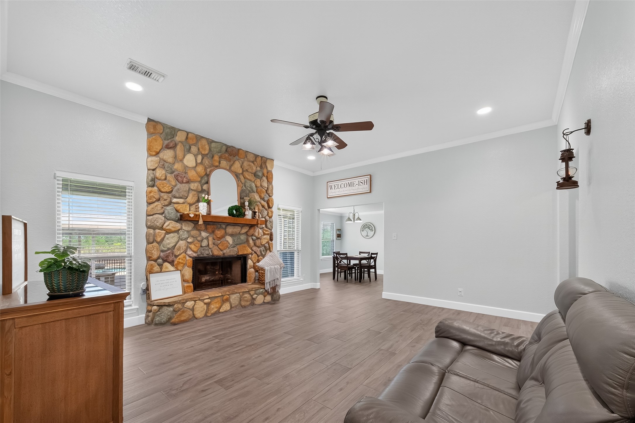 1030 Ginger Street Santa Fe, TX 77517 - Photo 10 of 50 a living room with furniture a fireplace and a flat screen tv