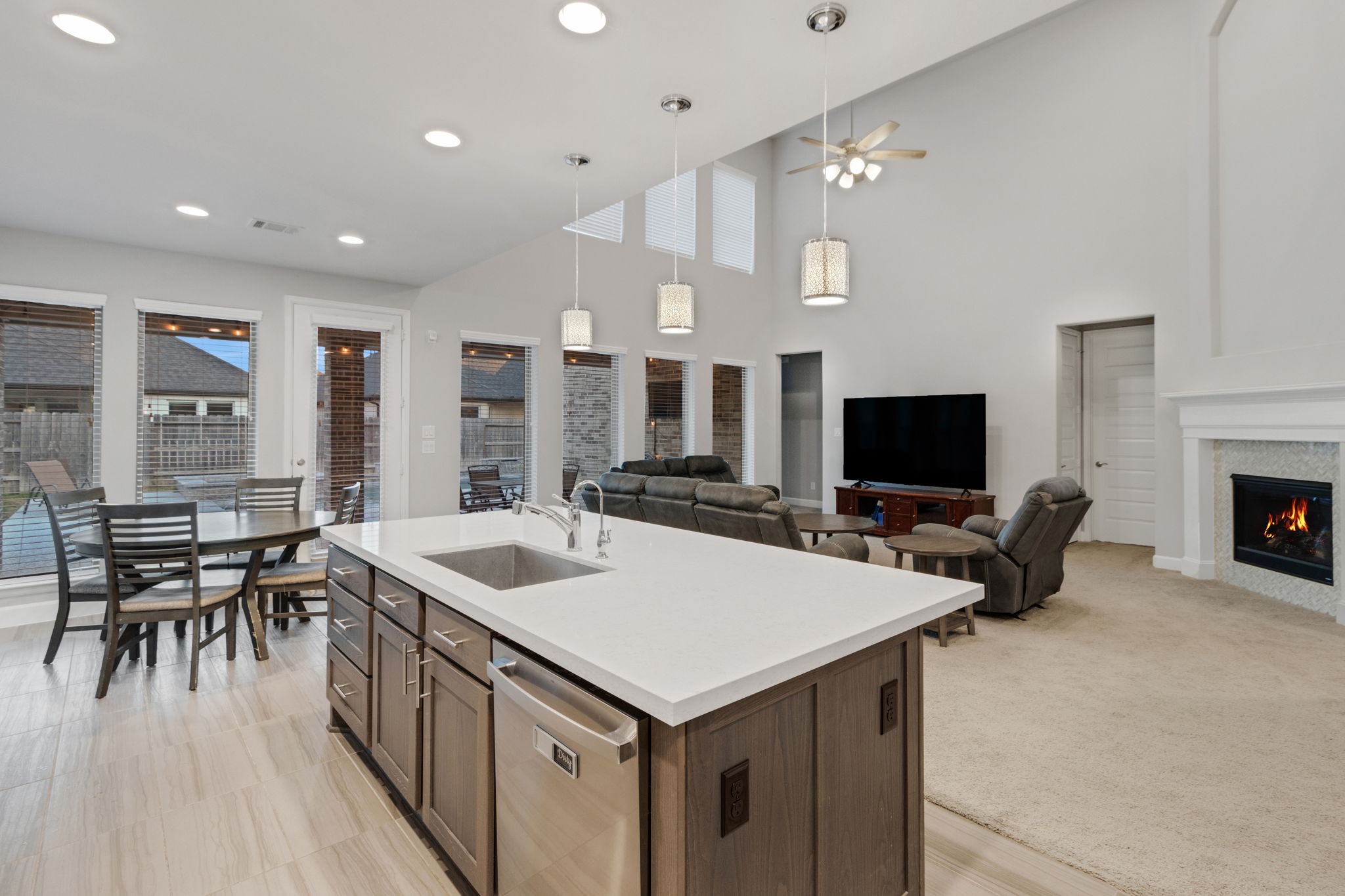 17467 Bayflower Conroe, TX 77385 - Photo 14 of 44 a kitchen with a stove a refrigerator and a dining table