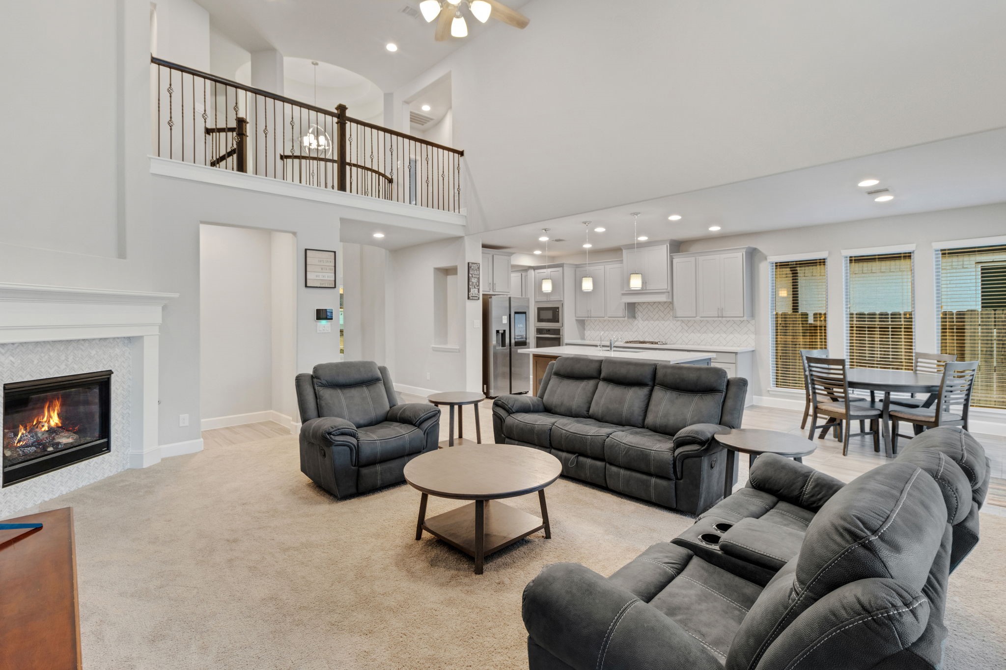 17467 Bayflower Conroe, TX 77385 - Photo 18 of 44 a living room with furniture and a fireplace