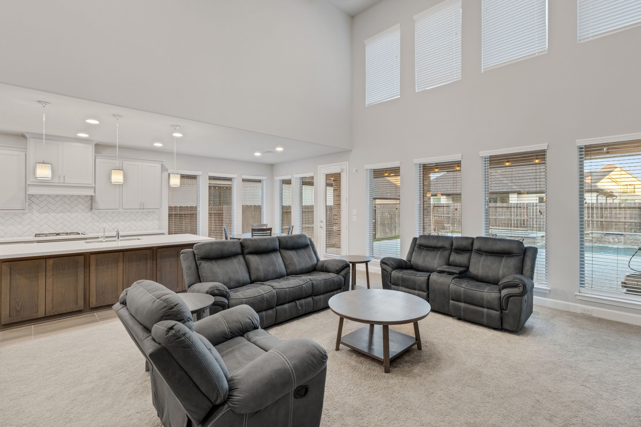 17467 Bayflower Conroe, TX 77385 - Photo 19 of 44 a living room with furniture and a large window