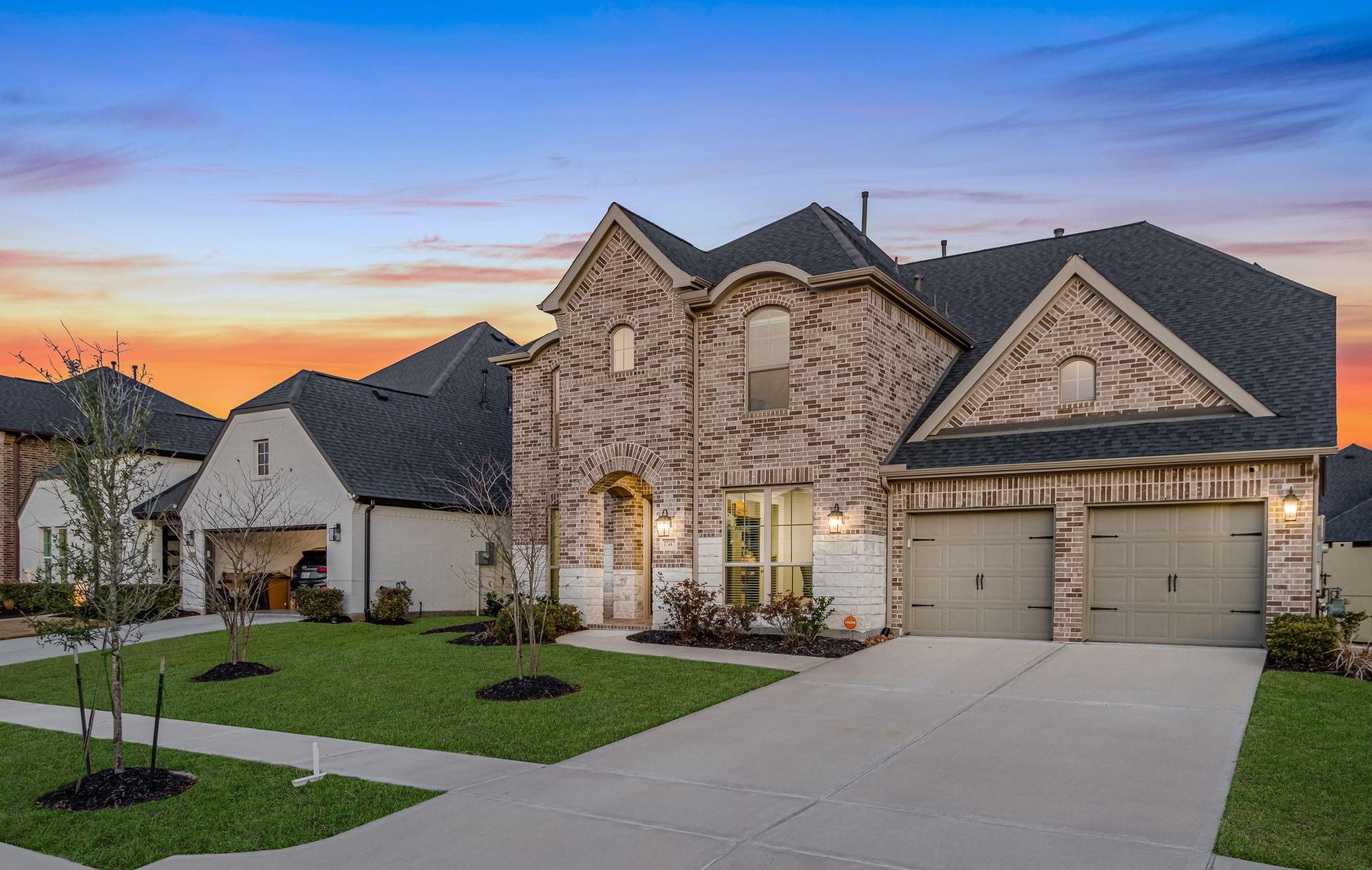 17467 Bayflower Conroe, TX 77385 - Photo 2 of 44 a front view of a house with a garden