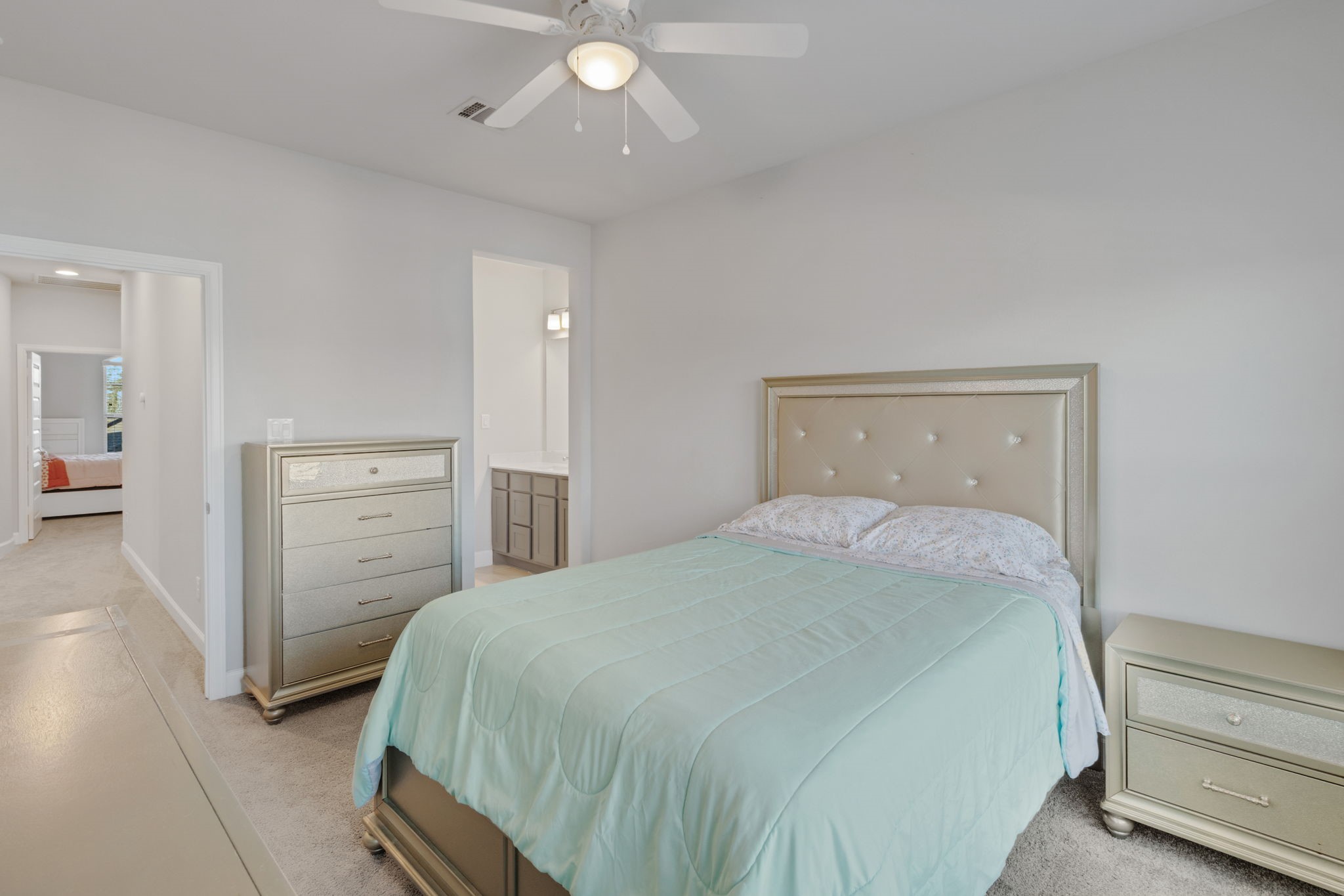 17467 Bayflower Conroe, TX 77385 - Photo 30 of 44 a bedroom with a bed and a walk in closet