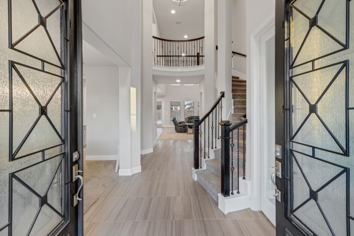 17467 Bayflower Conroe, TX 77385 - Photo 3 of 44 a view of entryway and hall with wooden floor