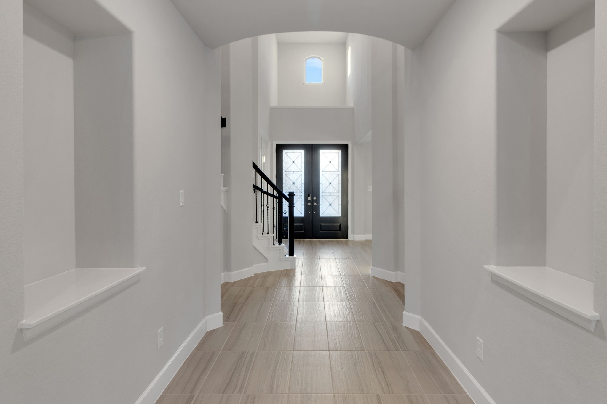 17467 Bayflower Conroe, TX 77385 - Photo 5 of 44 a view of a hallway view with wooden floor and staircase