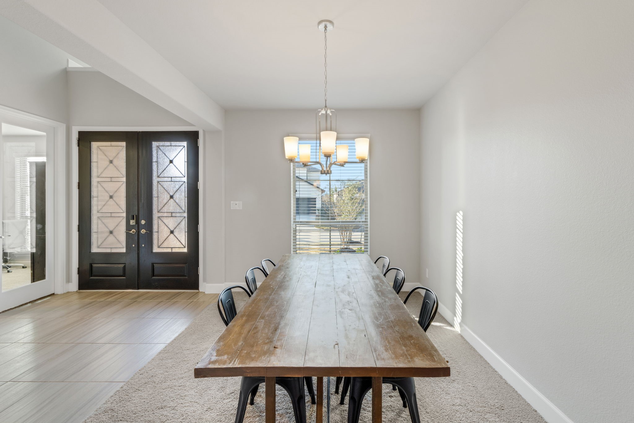 17467 Bayflower Conroe, TX 77385 - Photo 8 of 44 a view of a dining room with furniture window and wooden floor