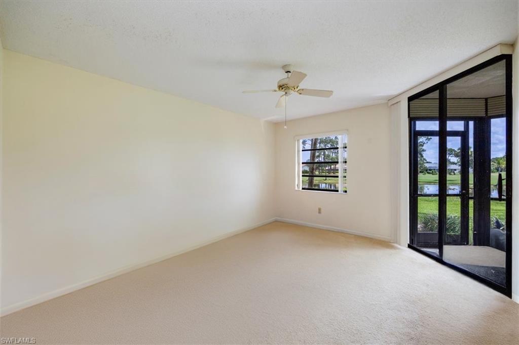 415 Augusta Boulevard, Unit 110 Naples, FL 34113 - Photo 16 of 31 an empty room with windows