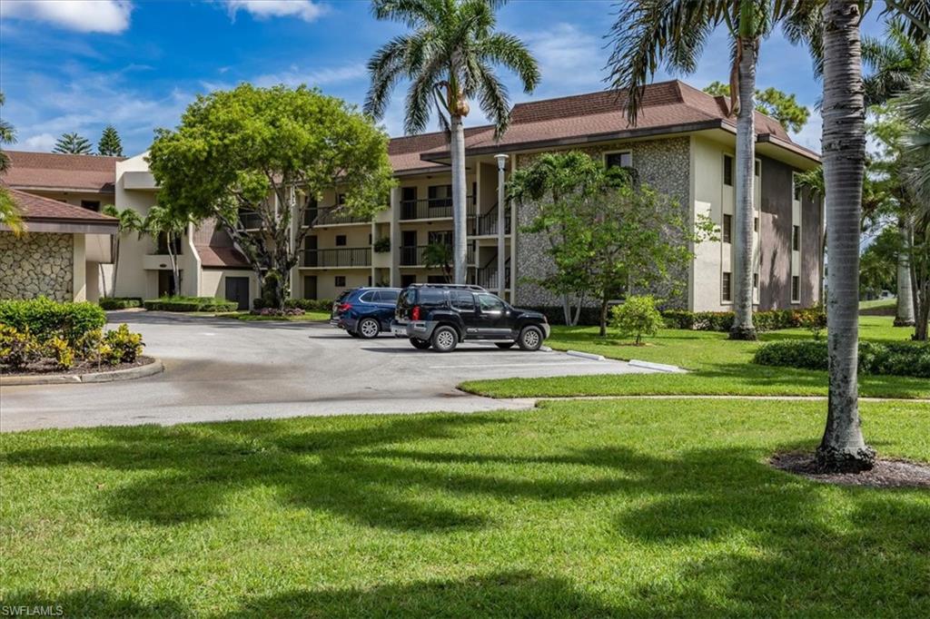 415 Augusta Boulevard, Unit 110 Naples, FL 34113 - Photo 10 of 31 a view of a house with a patio