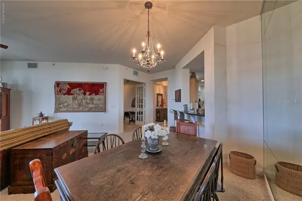 a large kitchen with stainless steel appliances granite countertop a sink and a counter top space