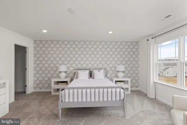 a room with a bed and a window