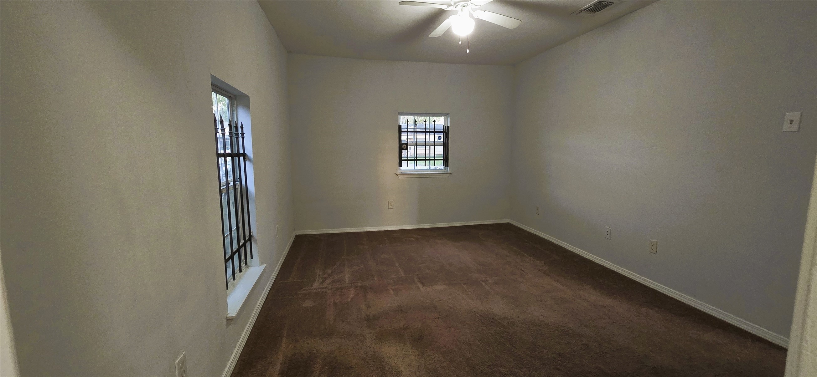 9410 Rosehaven Drive Houston, TX 77051 - Photo 6 of 8 an empty room with windows