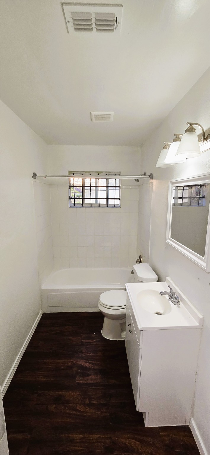 9410 Rosehaven Drive Houston, TX 77051 - Photo 7 of 8 a bathroom with a sink a toilet and a mirror