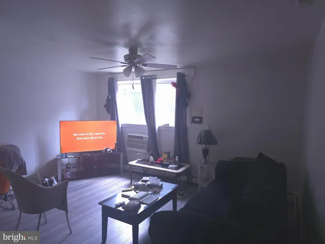 a view of a livingroom with furniture and window