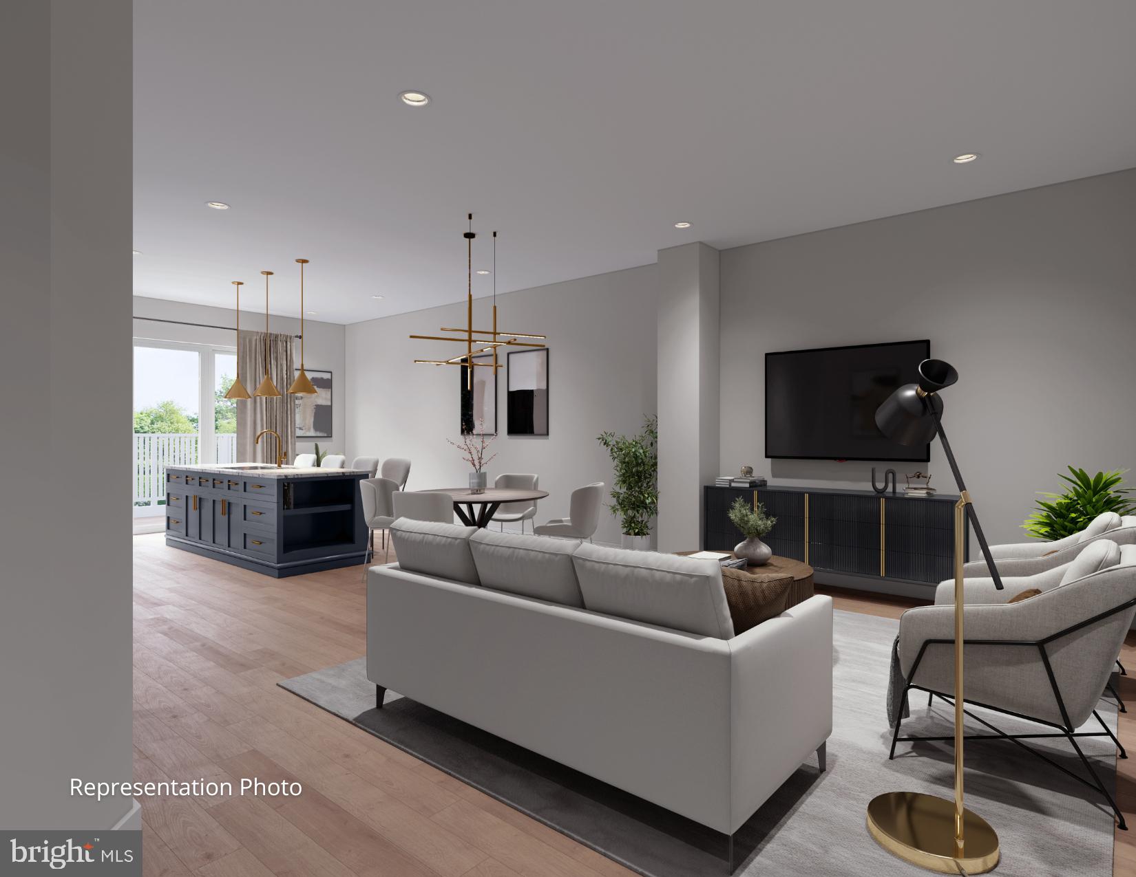 117 Blackford Boulevard, Unit 302 Lebanon, PA 17042 - Photo 2 of 6 a living room with furniture a flat screen tv and kitchen view