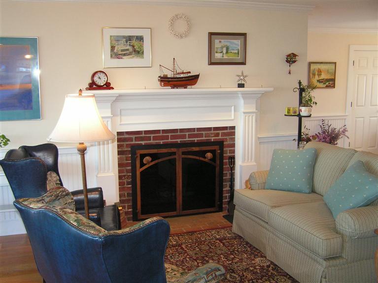 132 Bay Shore Road Hyannis, MA 02601 - Photo 11 of 34 a living room with furniture and a fireplace