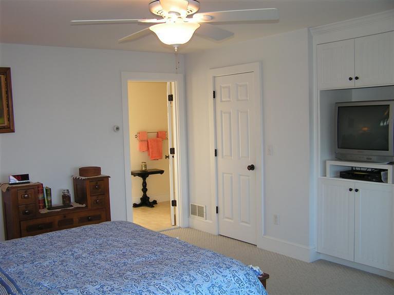132 Bay Shore Road Hyannis, MA 02601 - Photo 18 of 34 a bedroom with a bed and a flat screen tv