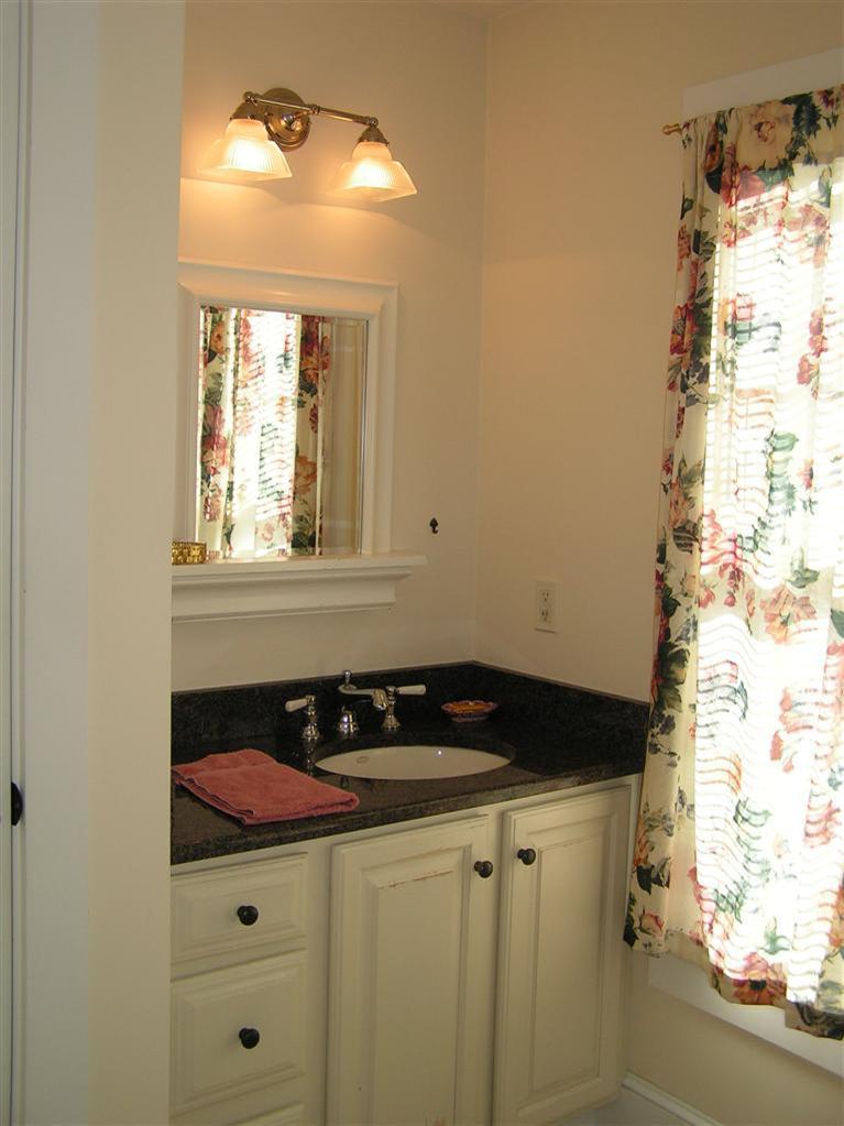 132 Bay Shore Road Hyannis, MA 02601 - Photo 19 of 34 a bathroom with a sink and a mirror