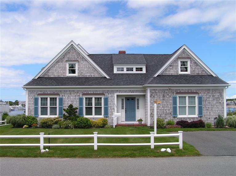 132 Bay Shore Road Hyannis, MA 02601 - Photo 2 of 34 a front view of a house with a yard
