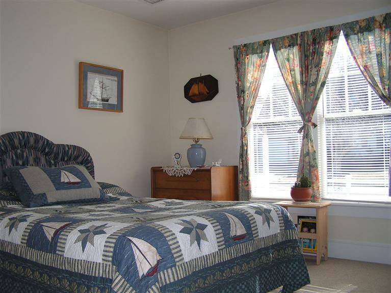 132 Bay Shore Road Hyannis, MA 02601 - Photo 21 of 34 a bedroom with a bed and a window