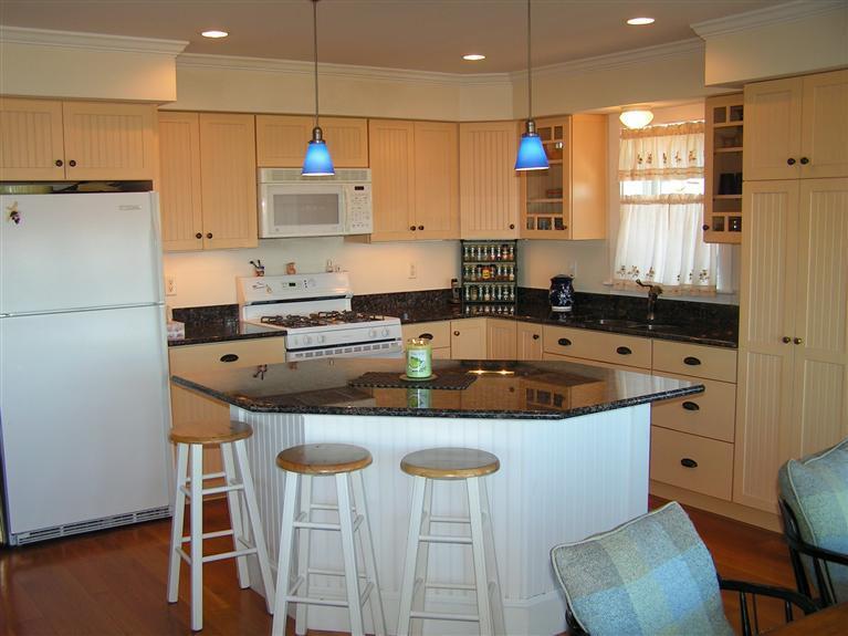 132 Bay Shore Road Hyannis, MA 02601 - Photo 8 of 34 a kitchen with granite countertop a sink a counter space appliances and cabinets