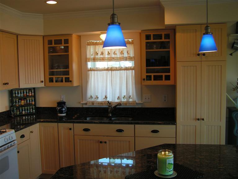 132 Bay Shore Road Hyannis, MA 02601 - Photo 10 of 34 a kitchen with a refrigerator and a stove top oven